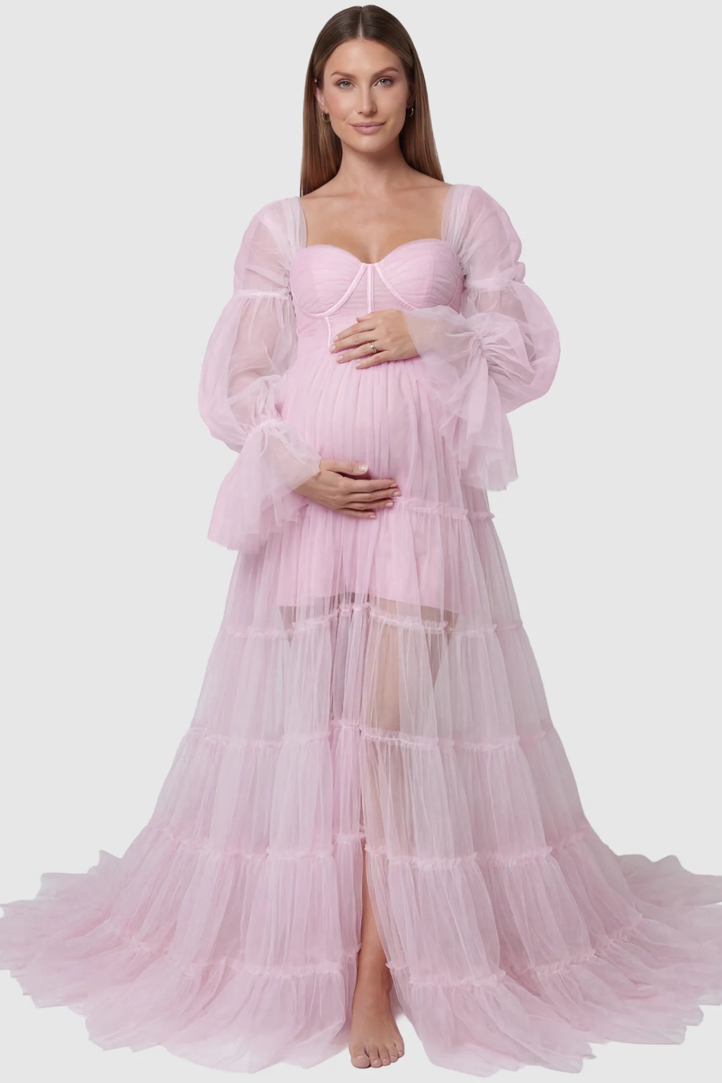 Tiered Tulle Long Sleeve Maternity photoshoot Gown in Pink featuring a sweetheart neckline and voluminous tulle layers on a pregnant model, front view.