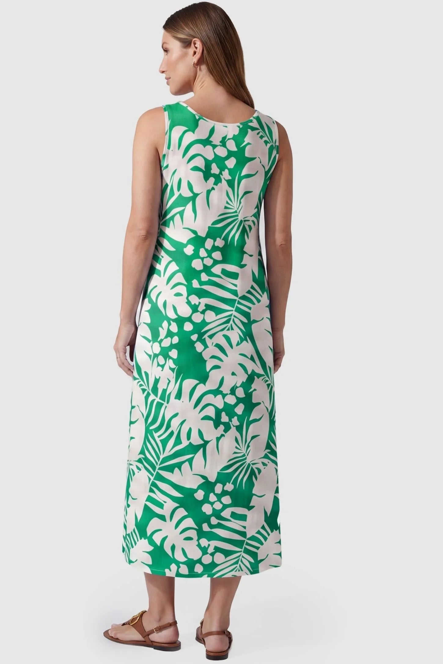Tropical Print Sleeveless Midi Maternity Dress Tropical Print Sleeveless Midi Maternity Dress in Green featuring a deep palm print design on a pregnant model, back view.