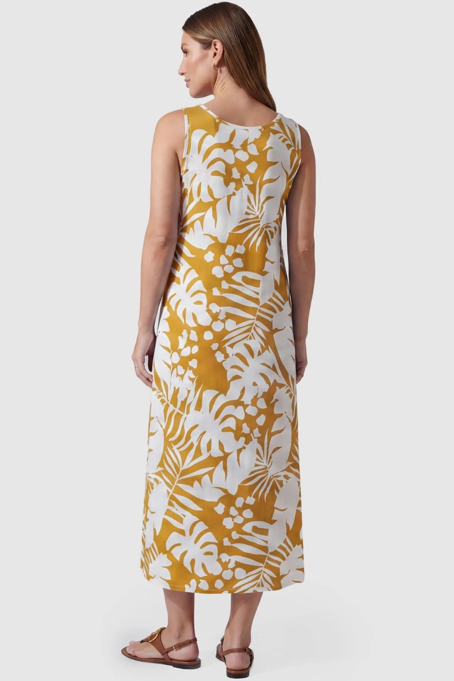 Tropical Print Sleeveless Midi Maternity Dress Tropical Print V-Back Sleeveless Midi Maternity Dress in Orange featuring a flowy midi silhouette on a pregnant model, back view.