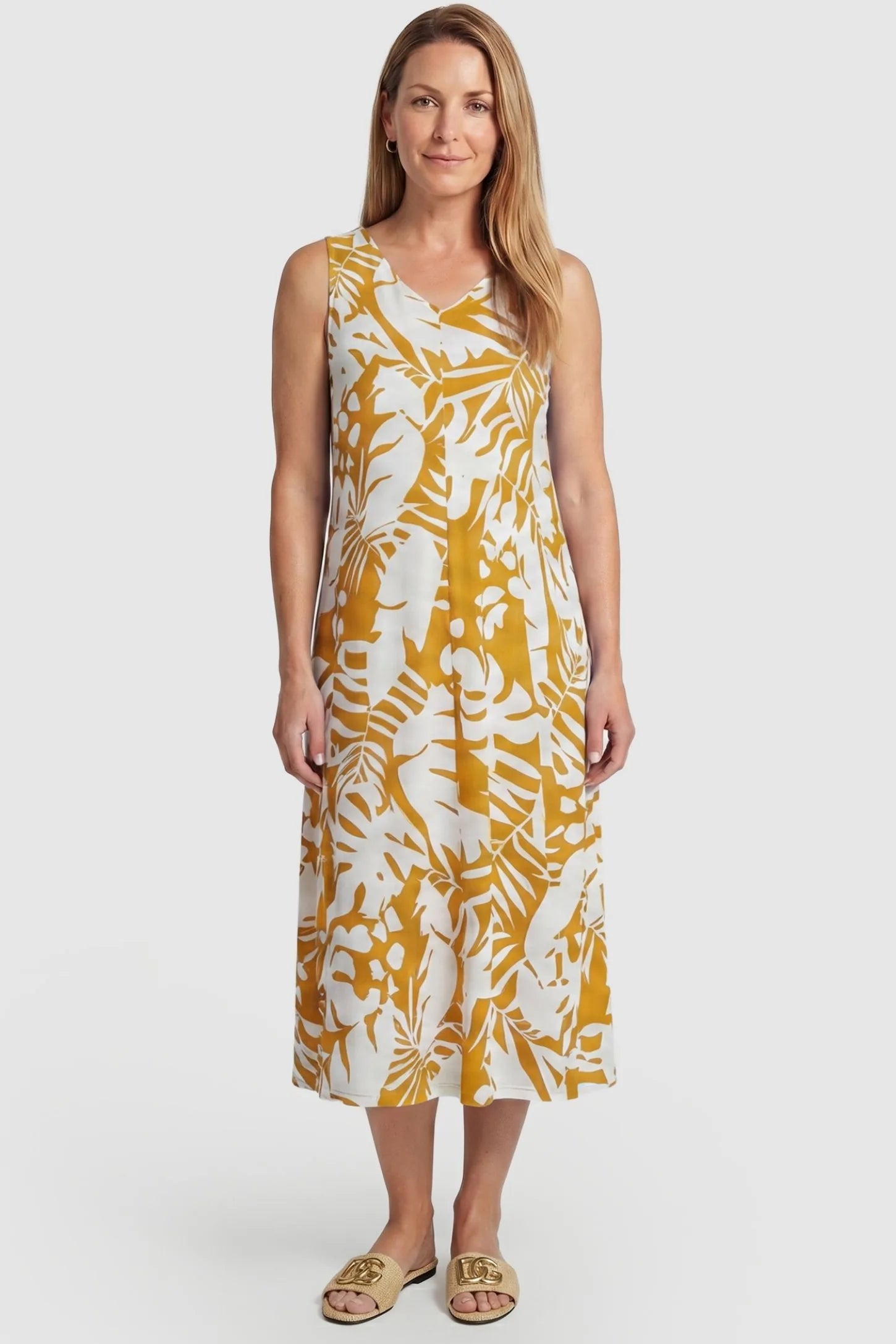 Tropical Print Sleeveless Midi Maternity Dress Tropical Print V-Back Sleeveless Midi Maternity Dress in Orange featuring a flowy midi silhouette on a postpartum model, front view.