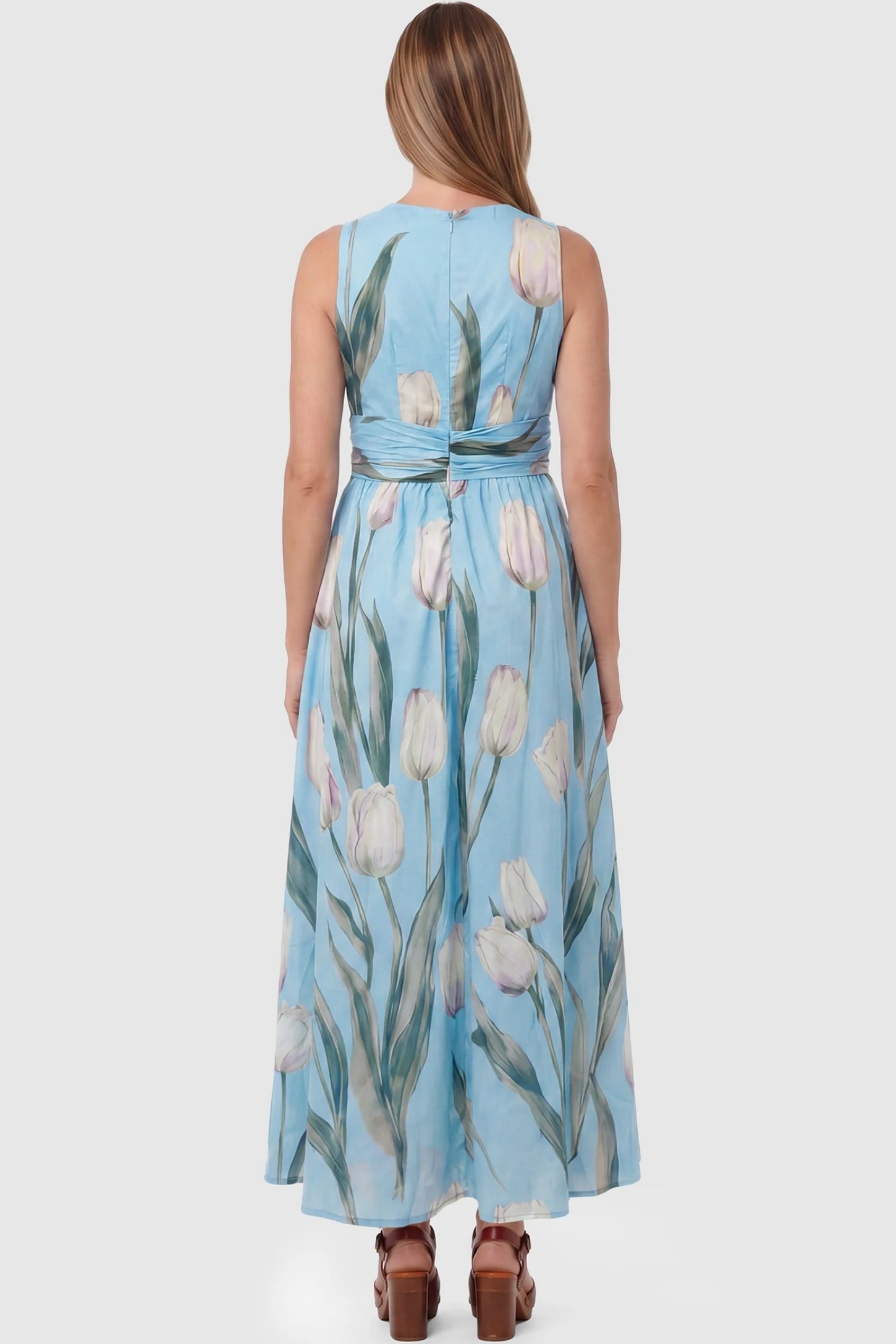 Tulip Print V-Neck Maxi Dress Tulip Print V-Neck Maxi Dress in Blue featuring a watercolor tulip print on a pregnant model, back view.