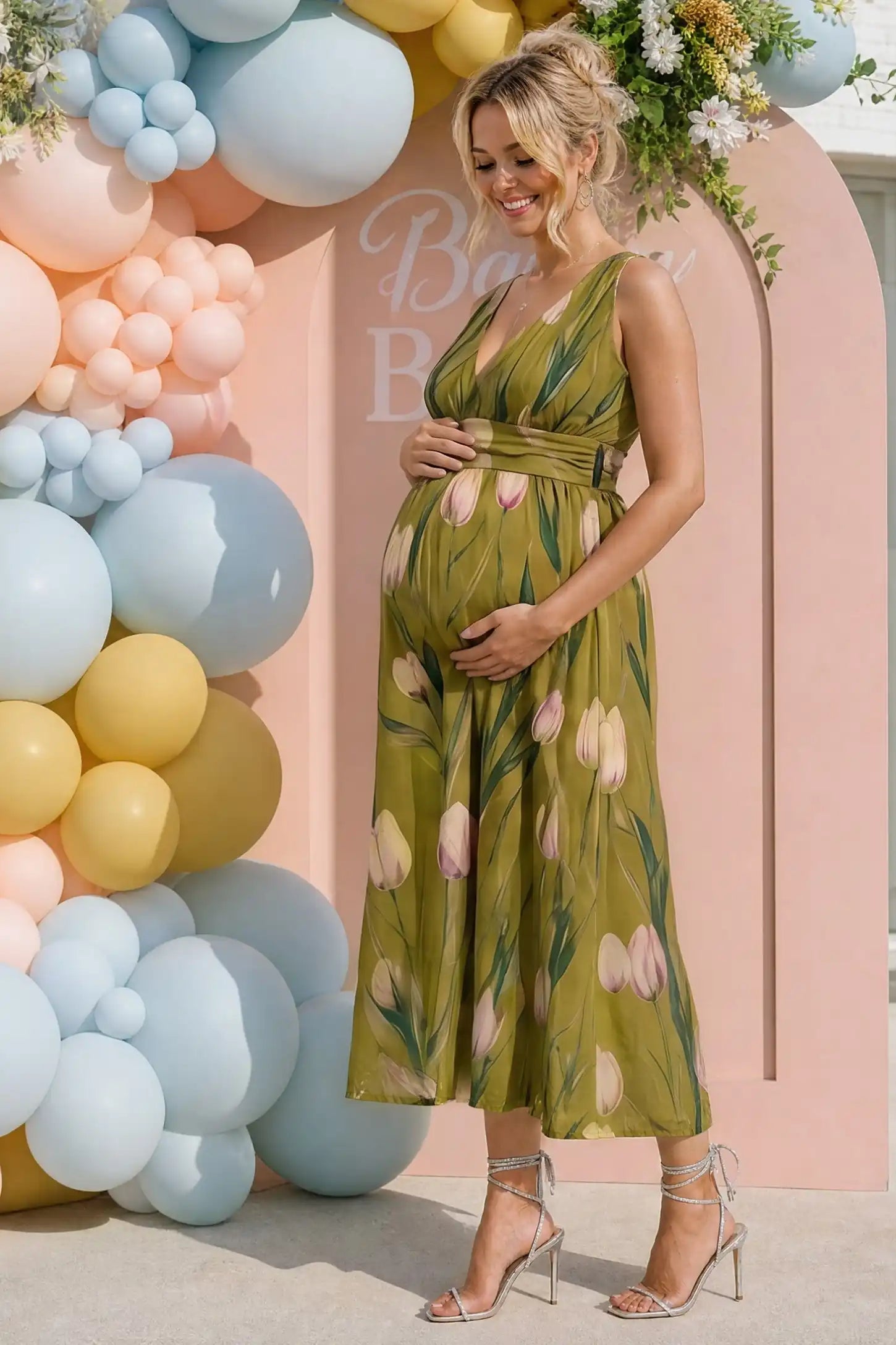 Tulip Print V-Neck Maxi Dress Tulip Print V-Neck Maxi Dress in Green featuring a bold botanical tulip print on a pregnant model, side view.