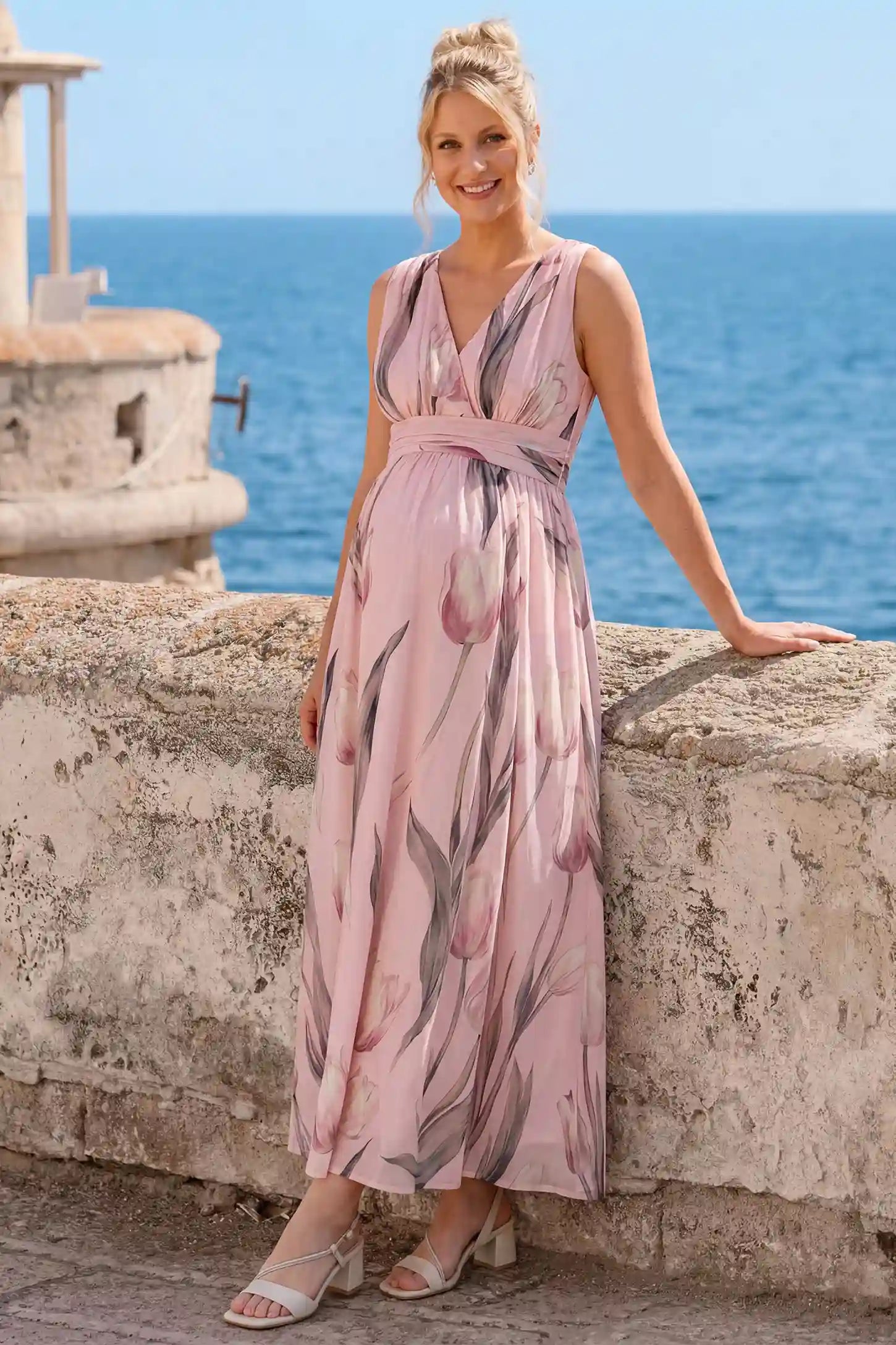Tulip Print V-Neck Maxi Dress in Pink featuring a soft watercolor tulip print on a pregnant model, front view.
