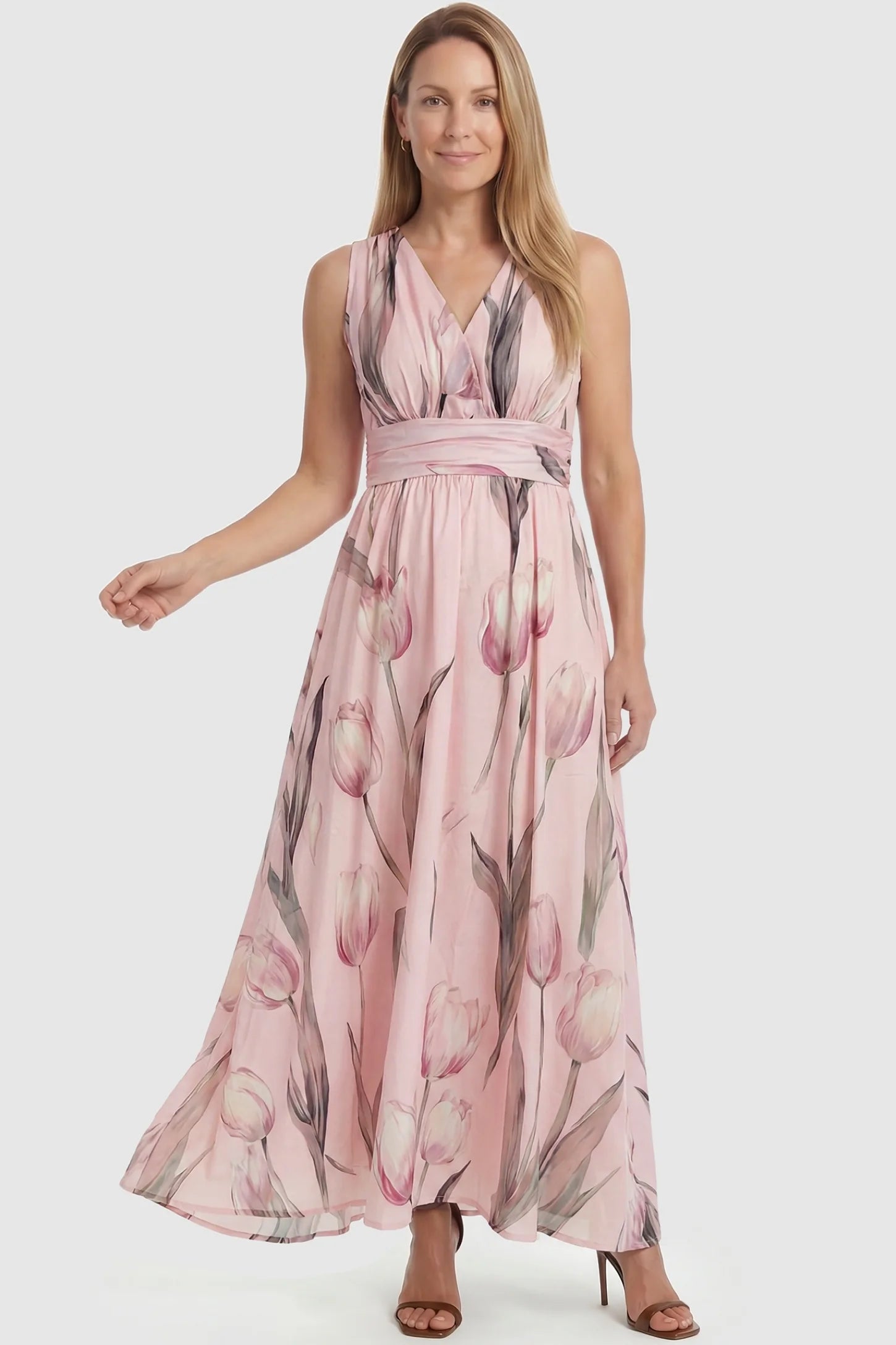 Tulip Print V-Neck Maxi Dress Tulip Print V-Neck Maxi Dress in Pink featuring a soft watercolor tulip print on a non-pregnant model, front view.