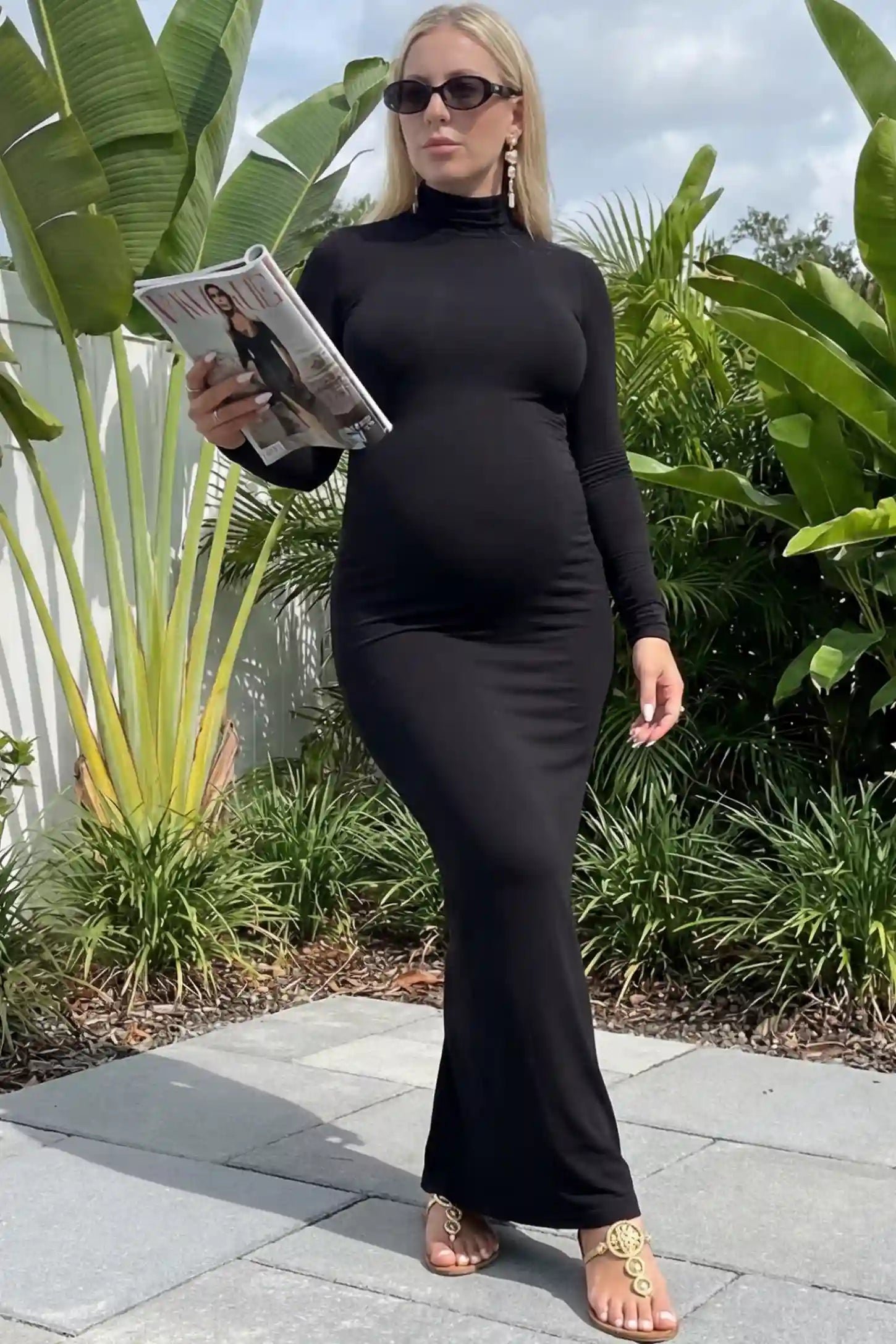 Turtle Neck Long Sleeve Maternity Maxi Dress in Black featuring a turtleneck and long sleeves on a pregnant woman, front view.