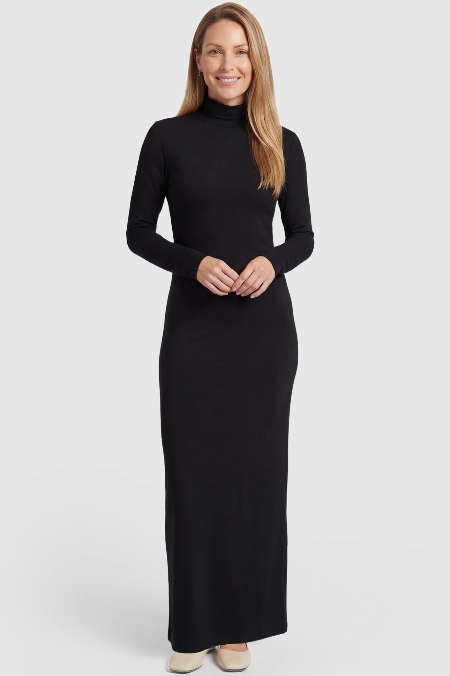 Turtle Neck Long Sleeve Maternity Maxi Dress Turtle Neck Long Sleeve Maternity Maxi Dress in Black featuring a turtleneck and long sleeves on a postpartum model, front view.