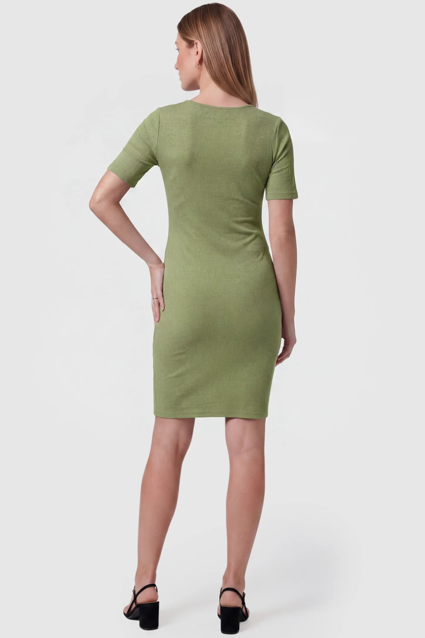 Twist Front Round Neck Short Sleeve Maternity Short Dress Twist Front Round Neck Maternity Short Dress in green featuring short sleeves. soft knit stretch on a pregnant model, back view.