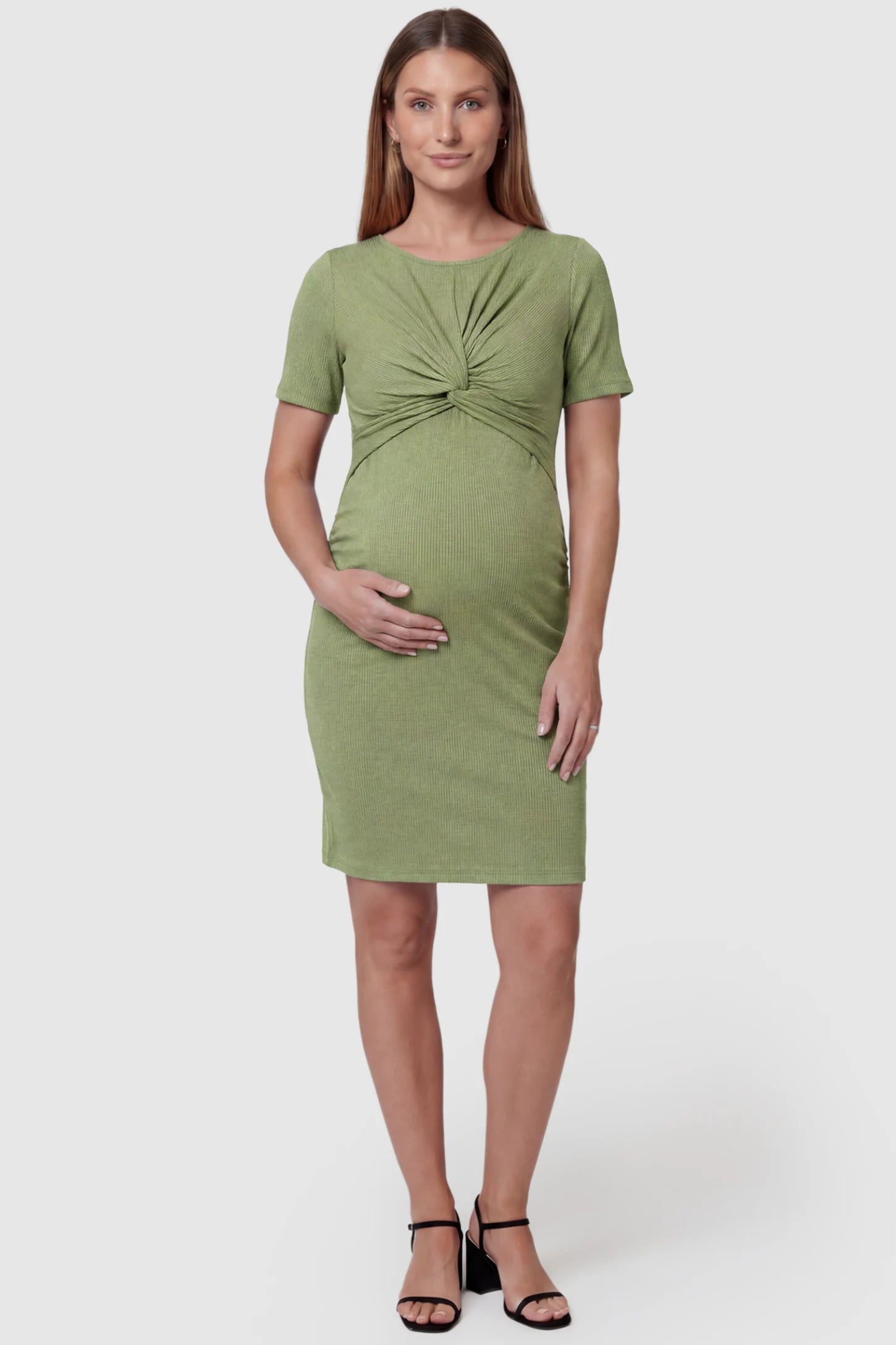 Twist Front Round Neck Maternity Short Dress in green featuring side ruched panels on a pregnant model, front view.