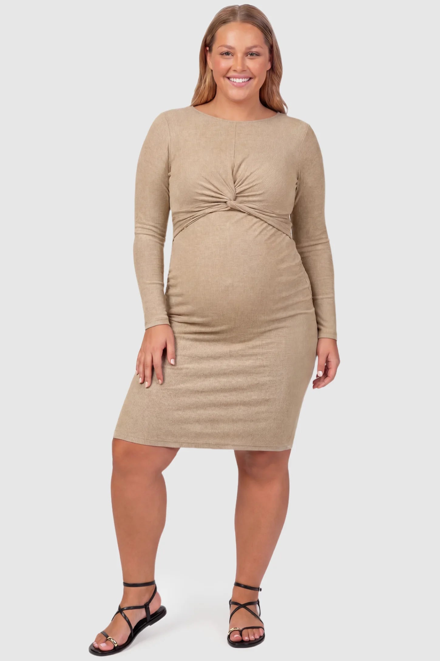 Twist Front Round Neck Short Sleeve Maternity Short Dress Twist Front Round Neck Maternity Short Dress in khaki featuring side ruched panels on a plus size pregnant model, front view.