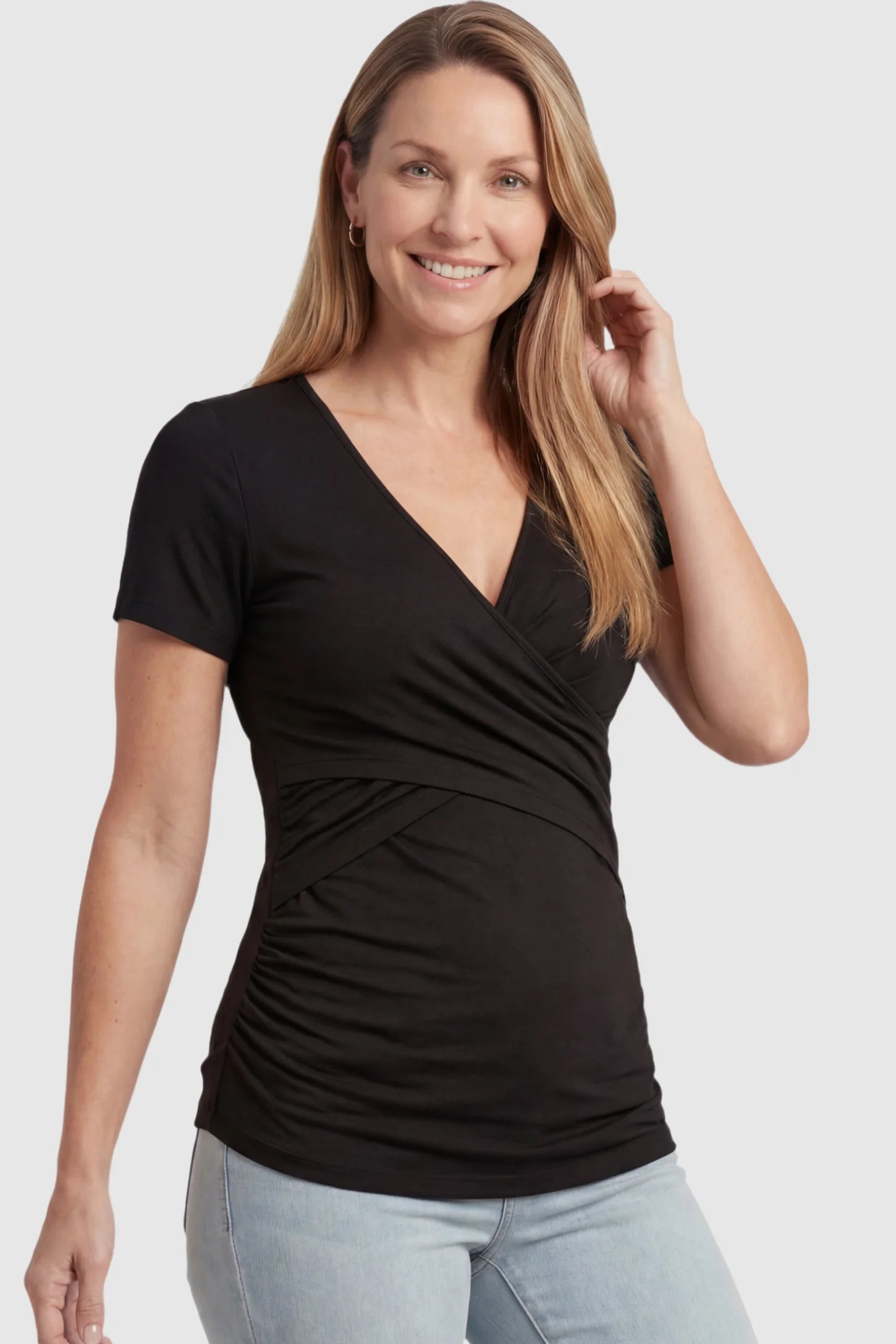 V Neck Crossover Maternity & Nursing Top Cross-Front Maternity and Nursing Top in Black featuring moisture-wicking fabric and wrap nursing access on a postpartum model.