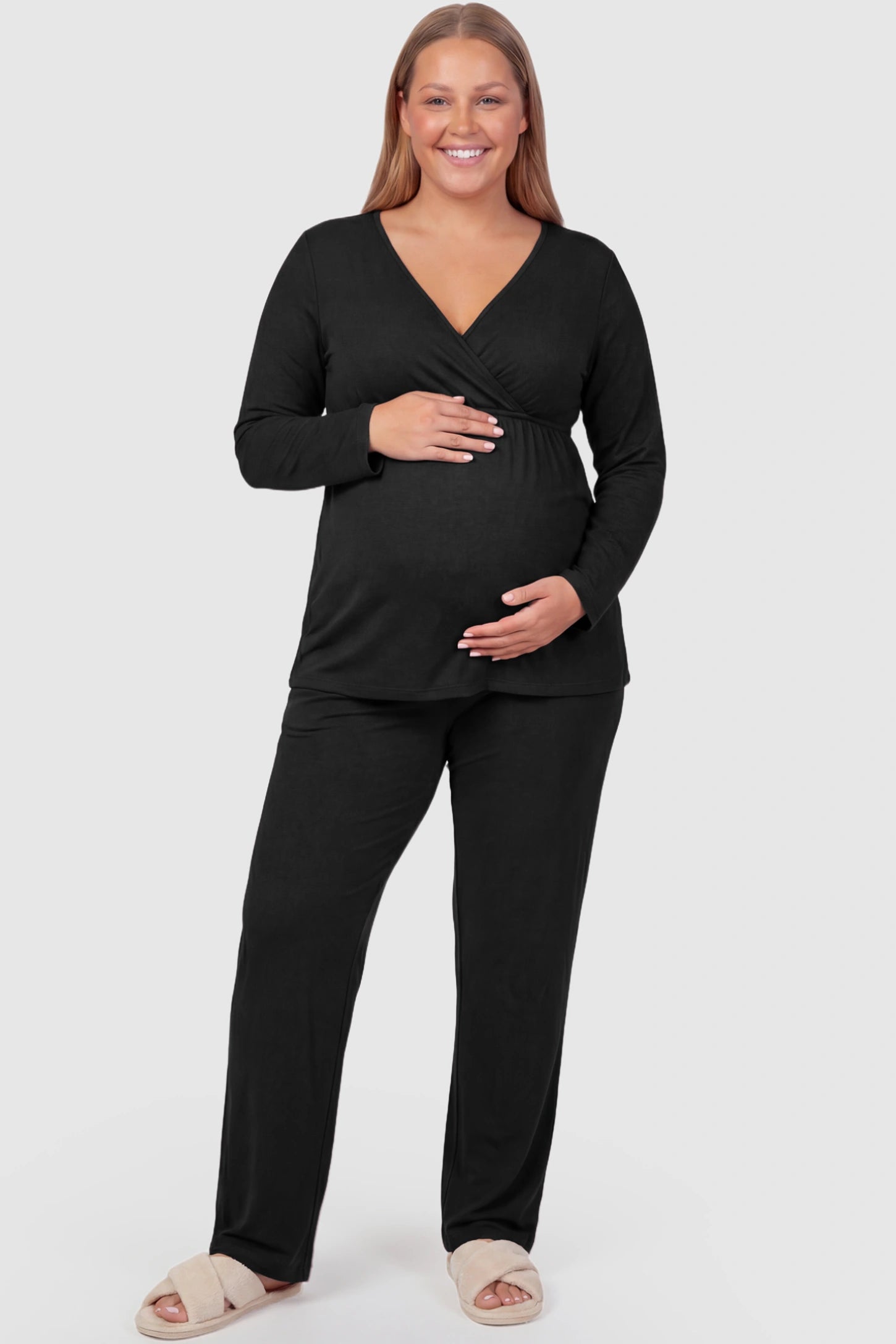 V-Neck Long Sleeve Top with Long Pants Maternity Sleepwear V-Neck Long Sleeve Maternity Lounge Set in Black featuring a crossover front on a Plus Size model showing front.