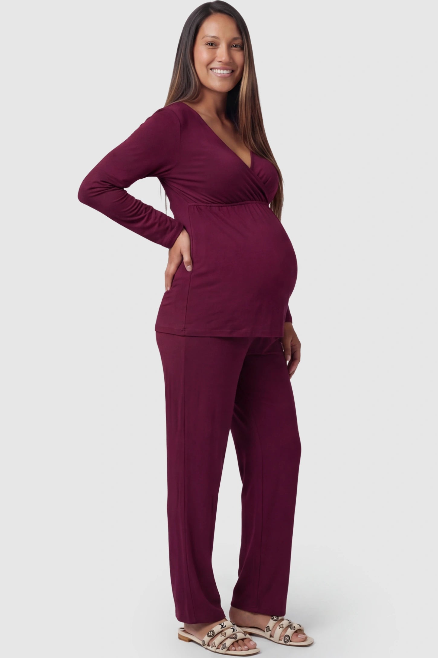 V-Neck Long Sleeve Maternity Lounge Set in Burgundy featuring a crossover front on a pregnant model showing side.