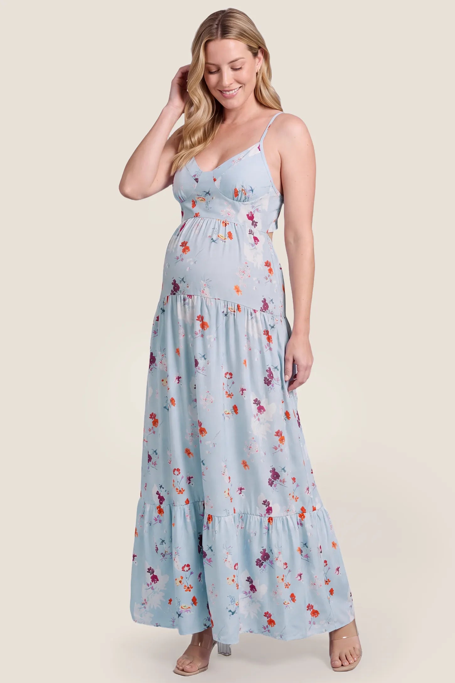 V-Neck Open Back Maternity Maxi Dress V-Neck Open Back Maternity Maxi Dress in Light Blue Floral highlighting the V-neck and maxi hem on a pregnant model, studio front view.