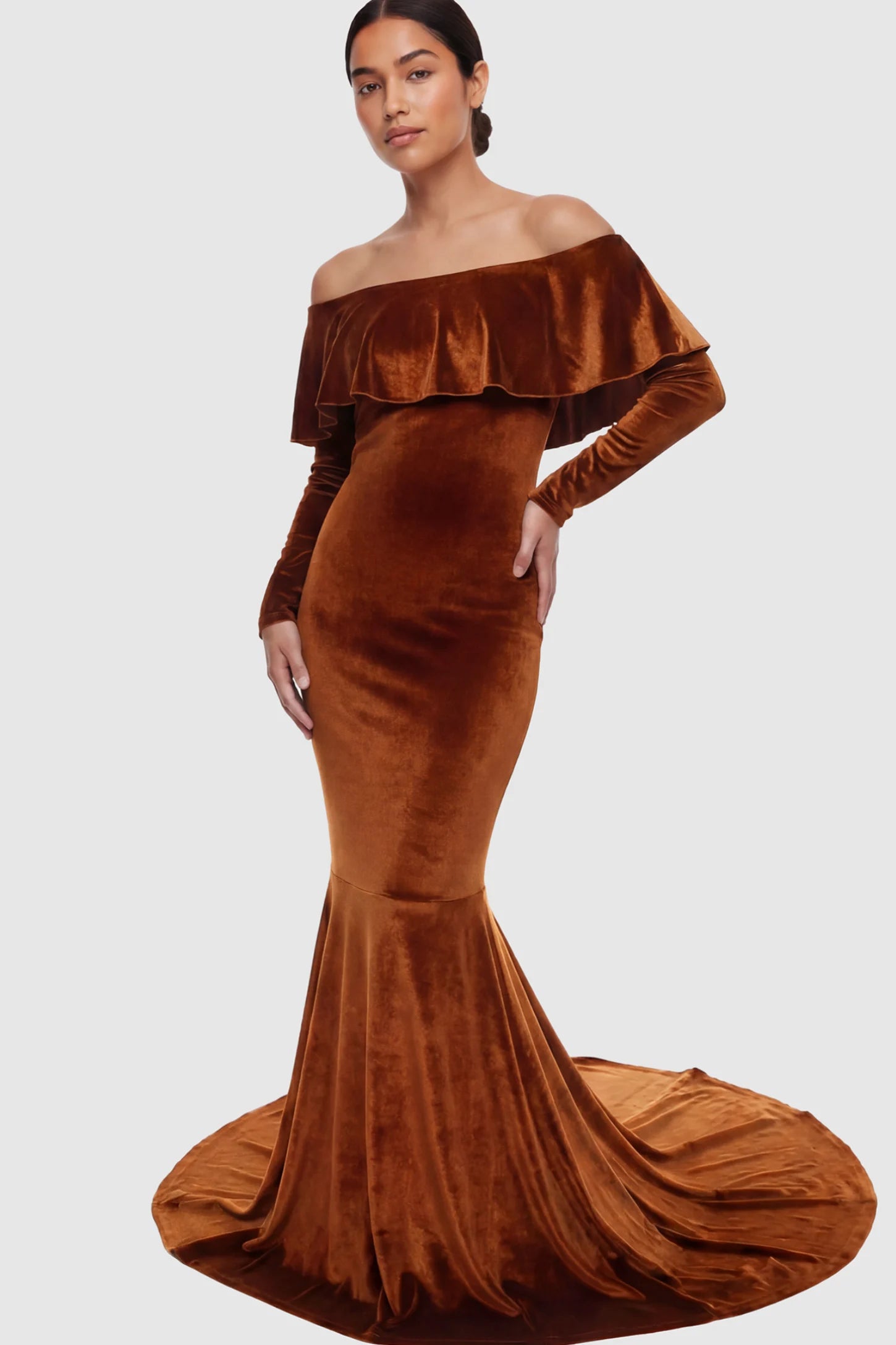 Velvet Off Shoulder Long Sleeve Maternity Mermaid Gown Velvet Off-the-Shoulder Maternity Mermaid Gown in Brown featuring a ruffled neckline and long sleeves on a postpartum model.