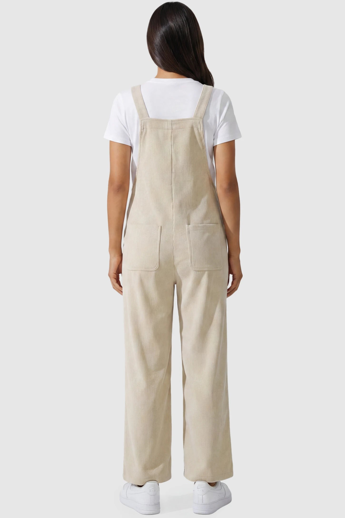 Adjustable Strap Wide-Leg Corduroy Maternity Overalls Floral Embroidered Wide-Leg Maternity Overalls in apricot featuring corduroy texture and pockets on a pregnant model, back view.