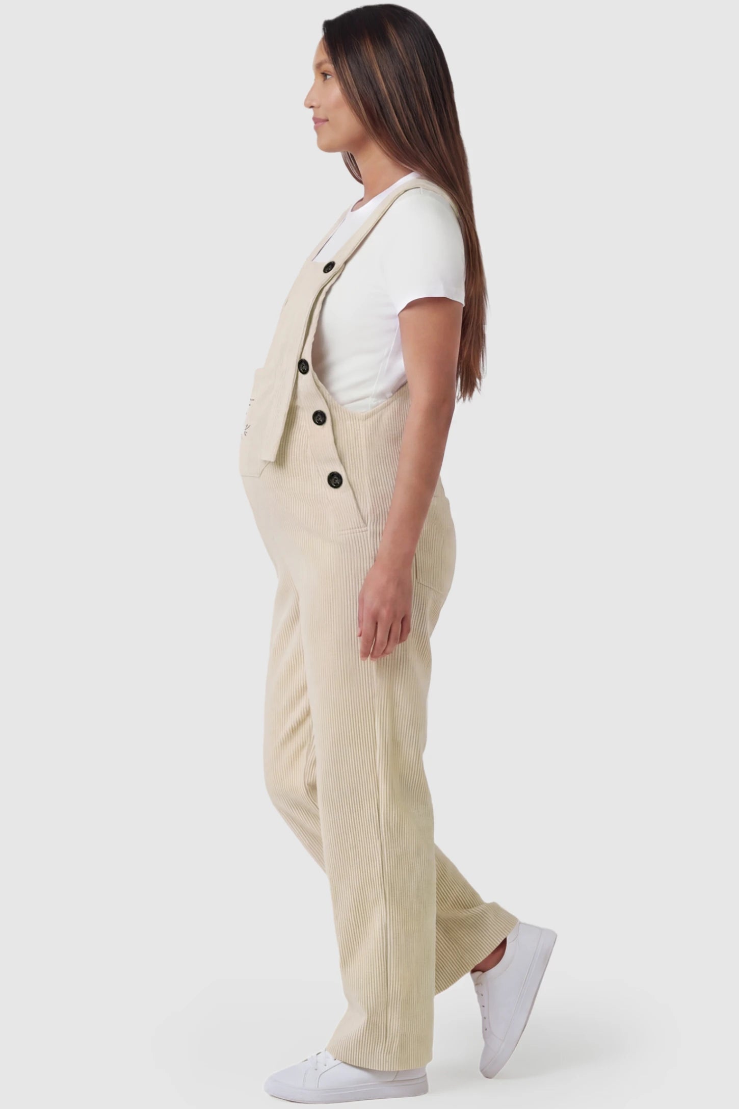 Adjustable Strap Wide-Leg Corduroy Maternity Overalls Floral Embroidered Wide-Leg Maternity Overalls in apricot featuring adjustable straps on a pregnant model, side view.