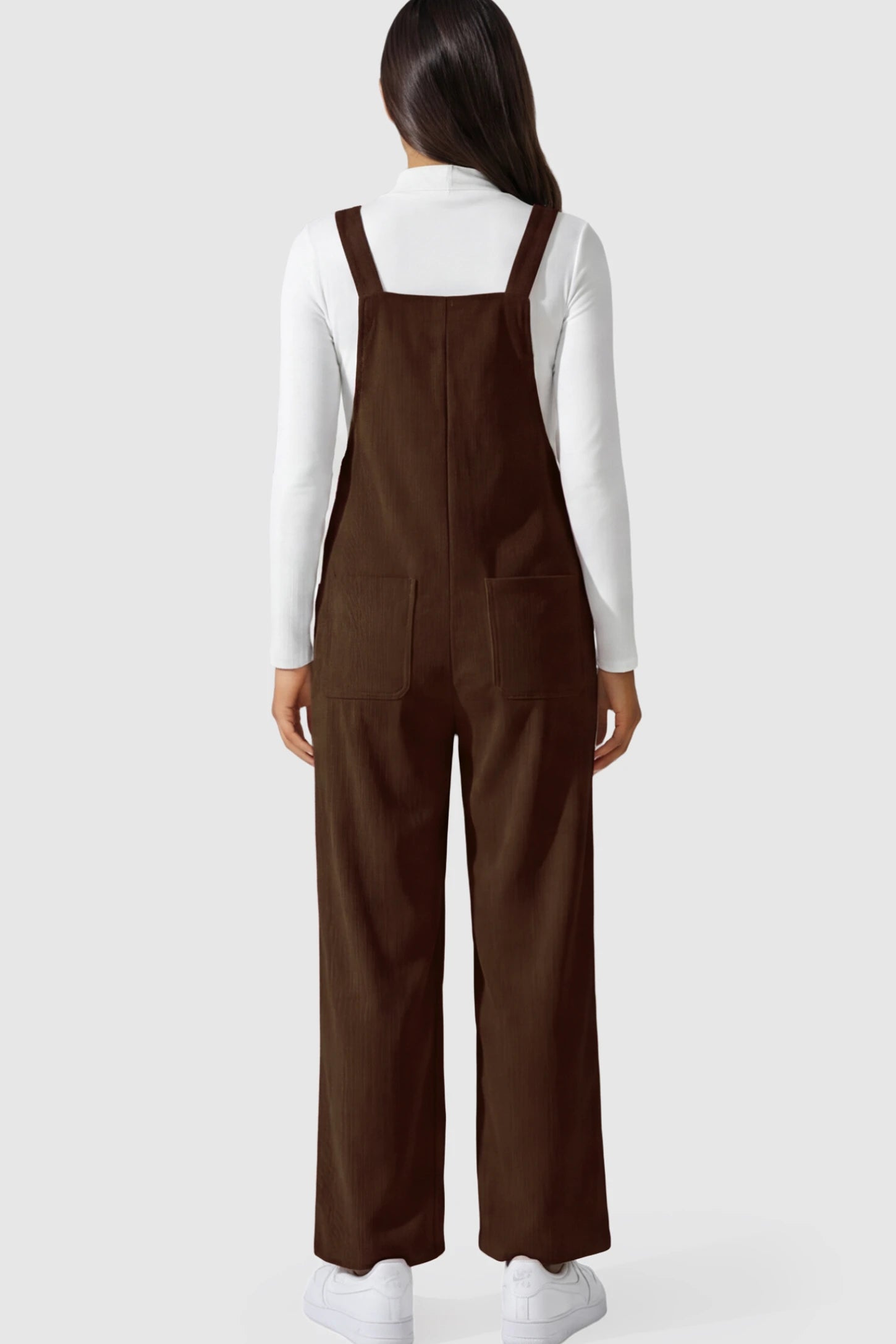 Adjustable Strap Wide-Leg Corduroy Maternity Overalls Floral Embroidered Wide-Leg Maternity Overalls in brown featuring corduroy texture and pockets on a pregnant model showing back.