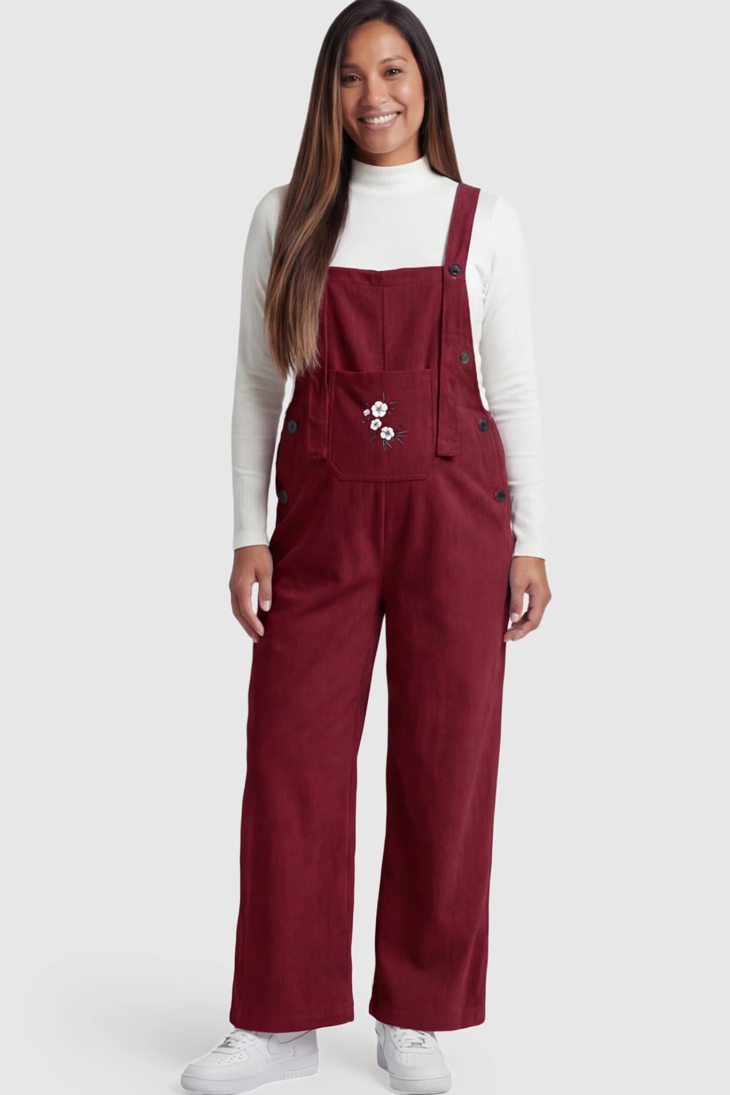 Adjustable Strap Wide-Leg Corduroy Maternity Overalls Floral Embroidered Wide-Leg Maternity Overalls in red featuring adjustable straps on a pregnant model posing front.