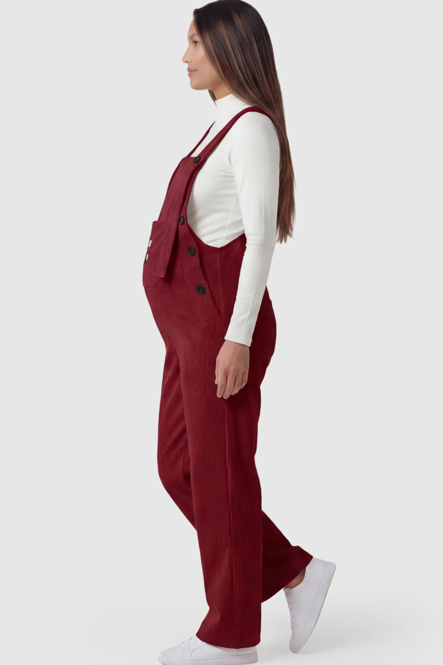 Adjustable Strap Wide-Leg Corduroy Maternity Overalls Floral Embroidered Wide-Leg Maternity Overalls in red featuring adjustable straps on a pregnant model showing side.
