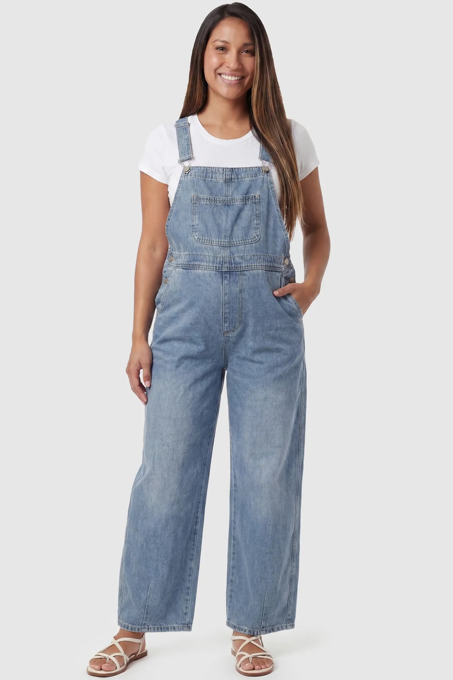 Wide Leg Relaxed Fit Maternity Overalls in light blue featuring soft washed denim on a pregnant model, front view.