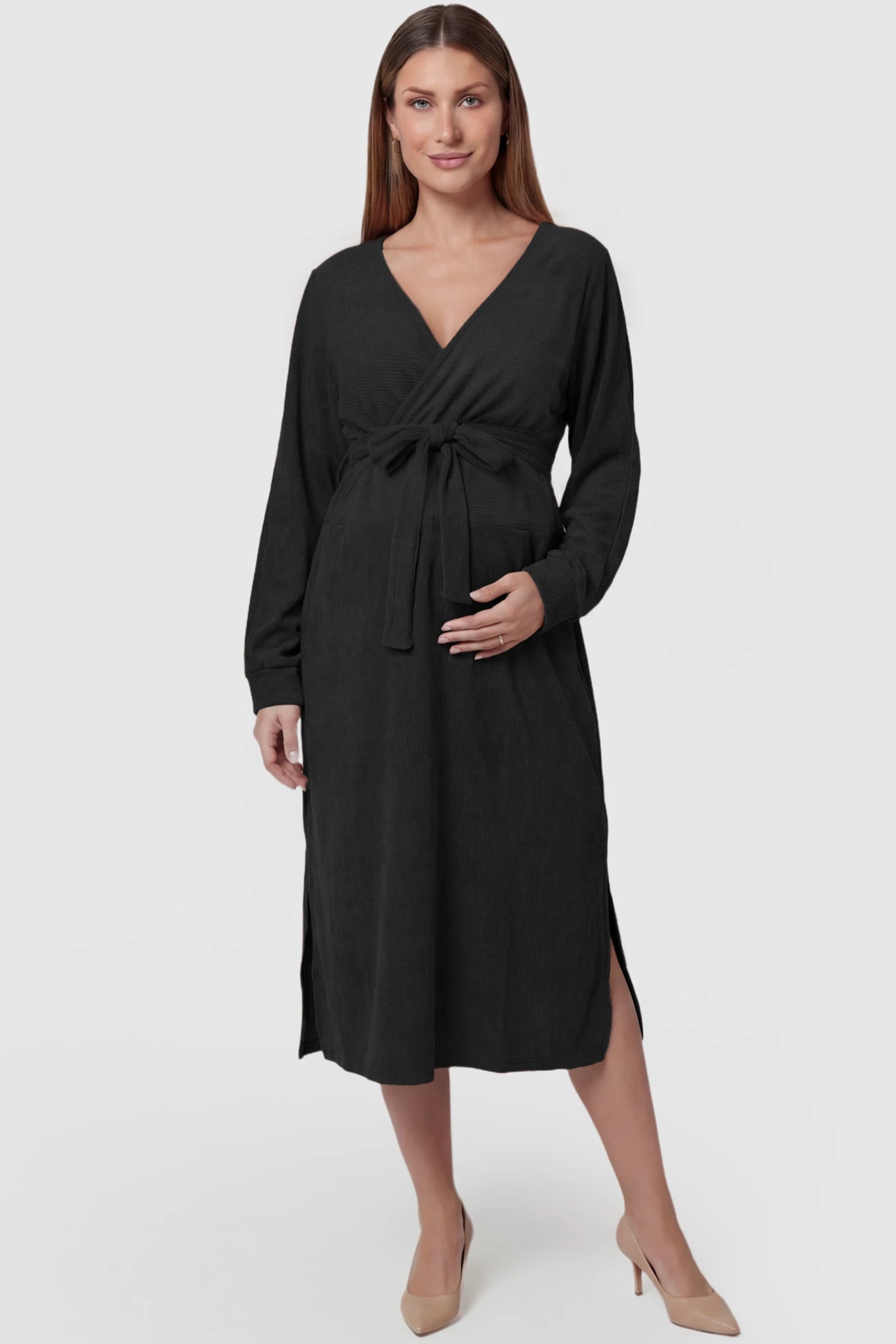 Wrap Front Tie Waist Long Sleeve Maternity Midi Dress Wrap Front Tie Waist Long Sleeve Maternity Midi Dress in Black featuring adjustable tie waist and side slits on a pregnant model, front view.