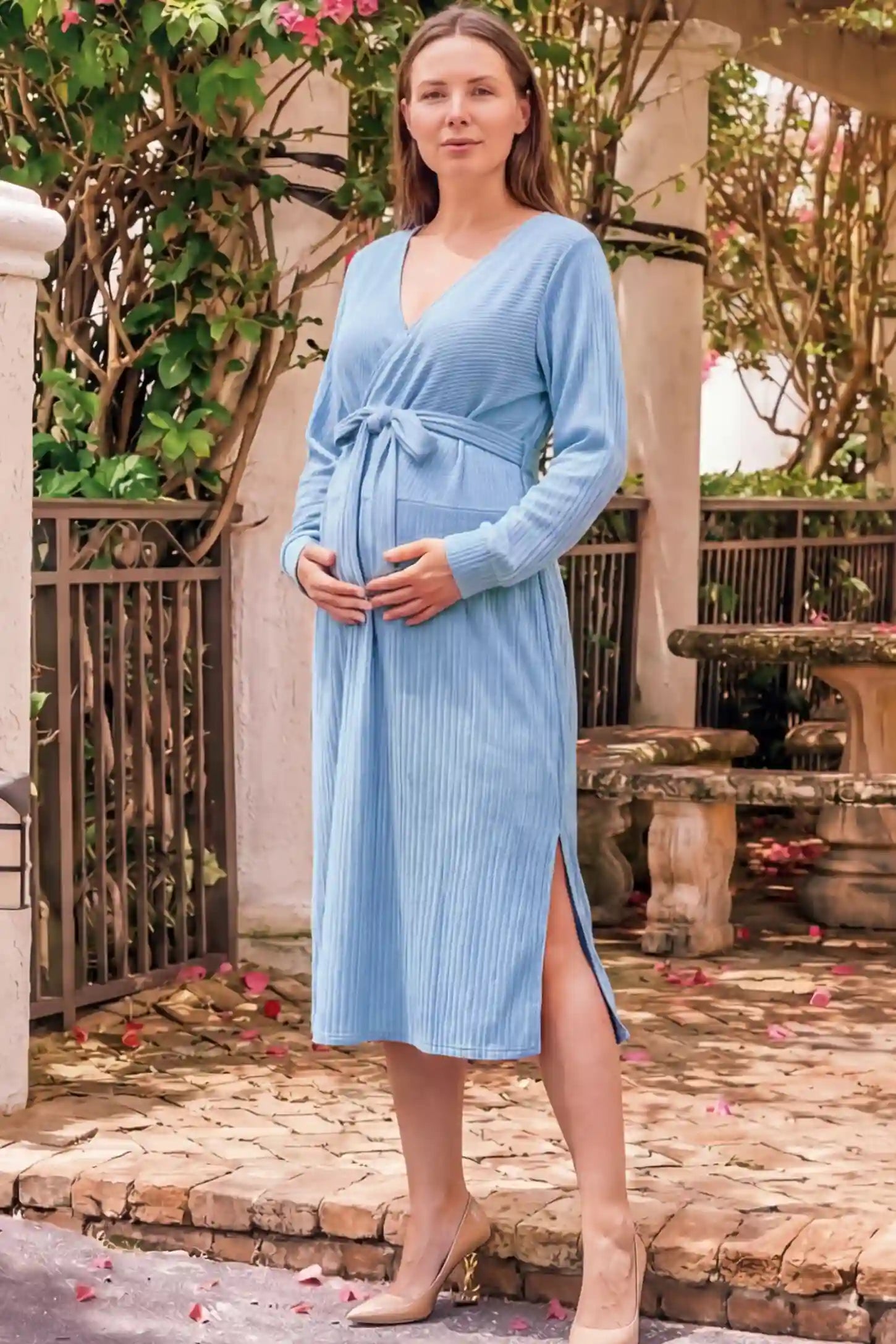 Wrap Front Tie Waist Long Sleeve Maternity Midi Dress Wrap Front Tie Waist Long Sleeve Maternity Midi Dress in Light Blue featuring adjustable tie waist and side slits on a pregnant woman in outdoor setting, front view.