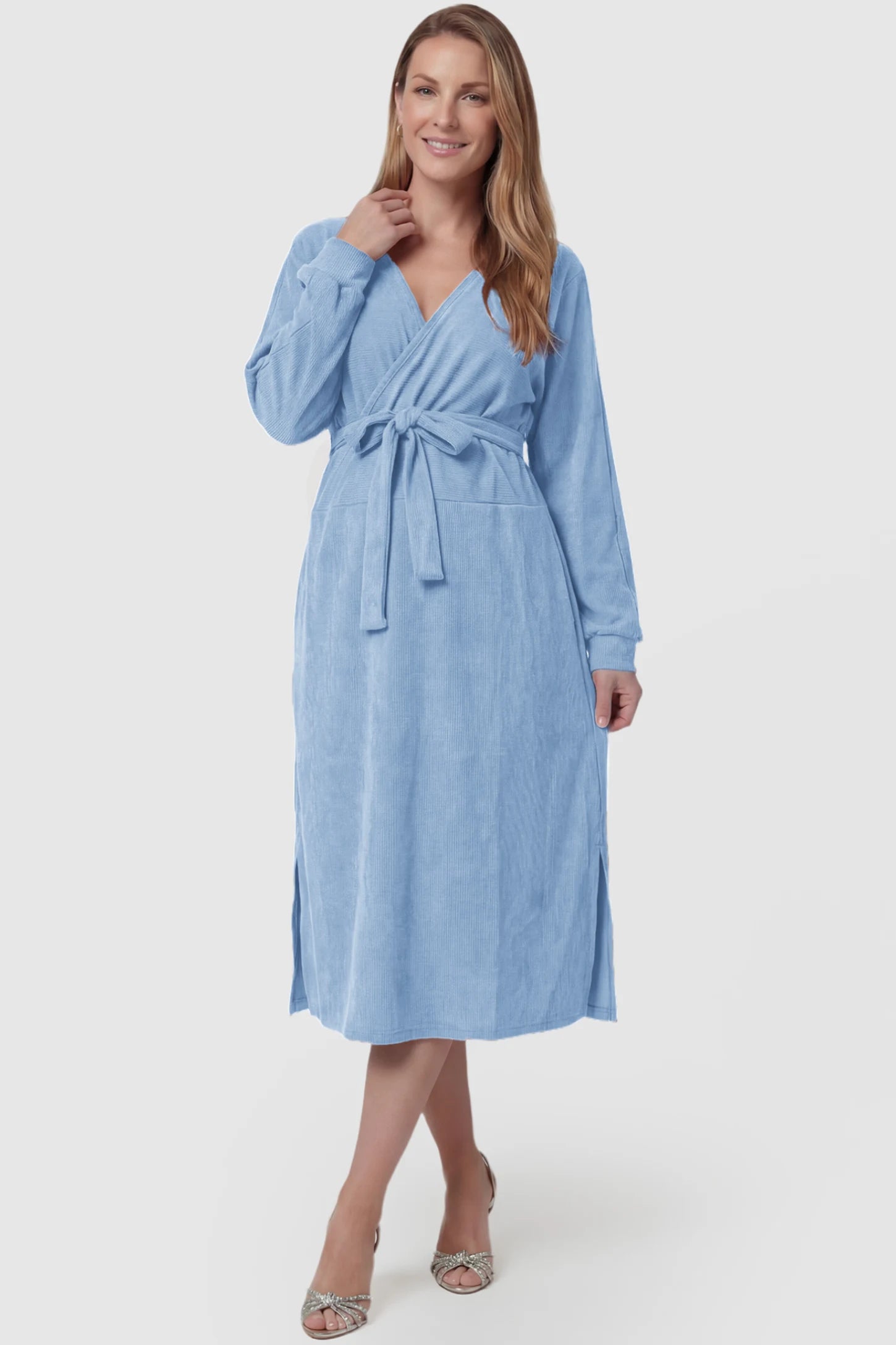 Wrap Front Tie Waist Long Sleeve Maternity Midi Dress Wrap Front Tie Waist Long Sleeve Maternity Midi Dress in Light Blue featuring adjustable tie waist and side slits on a postpartum model, front view.