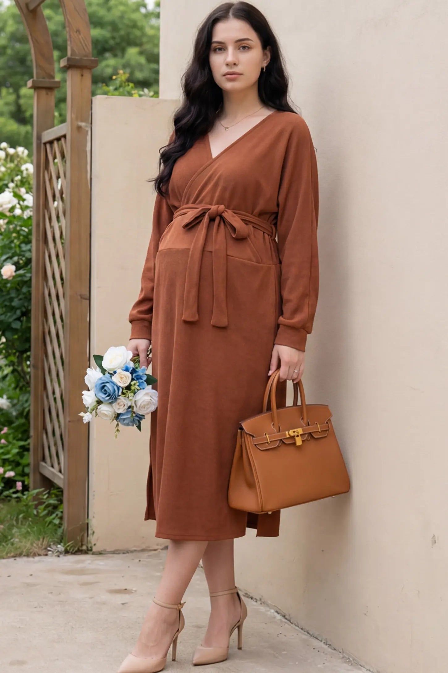 Wrap Front Tie Waist Long Sleeve Maternity Midi Dress Wrap Front Tie Waist Long Sleeve Maternity Midi Dress in Orange featuring adjustable tie waist and side slits on a pregnant woman in outdoor setting, front view.