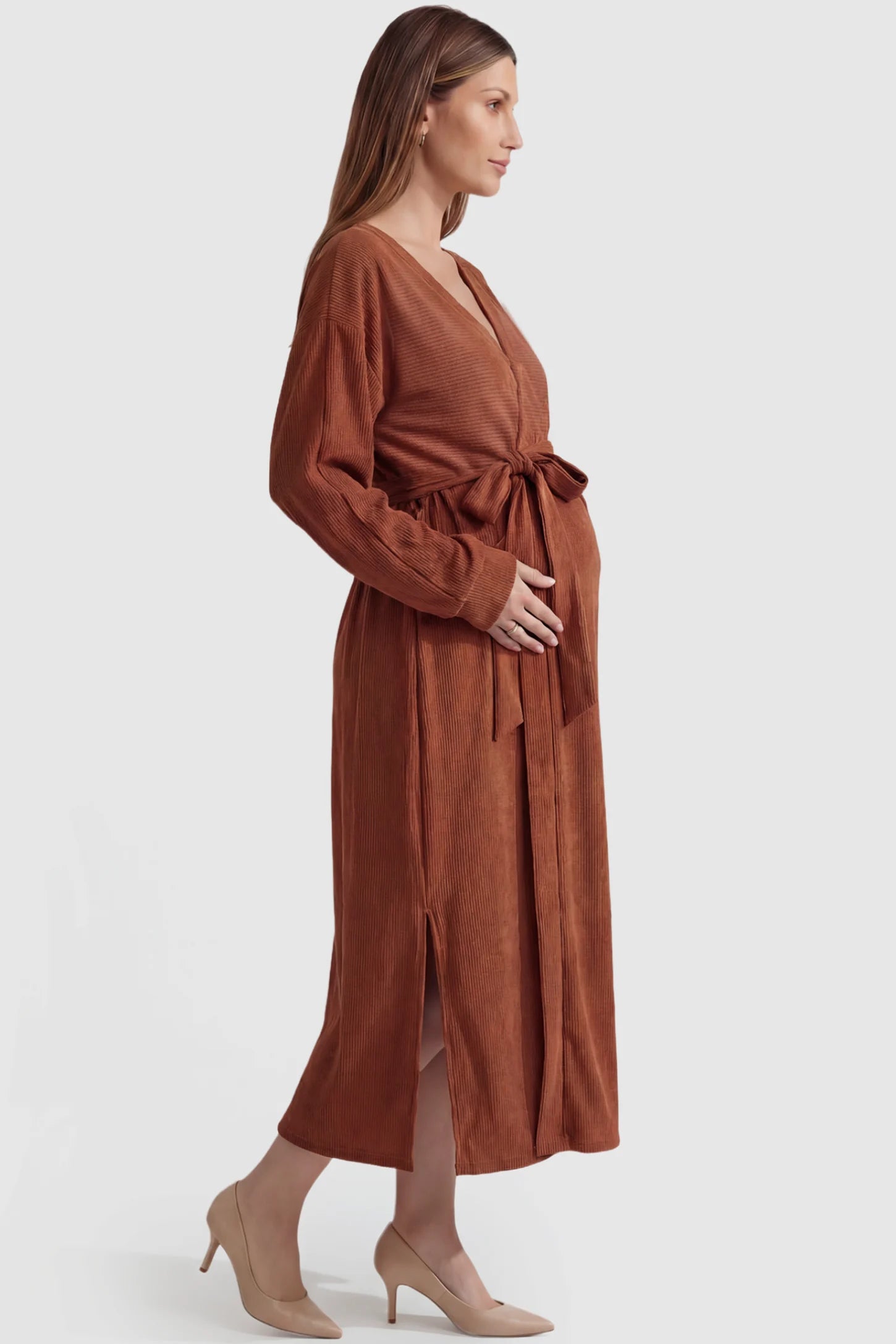 Wrap Front Tie Waist Long Sleeve Maternity Midi Dress Wrap Front Tie Waist Long Sleeve Maternity Midi Dress in Orange featuring adjustable tie waist and side slits on a pregnant model, side view.