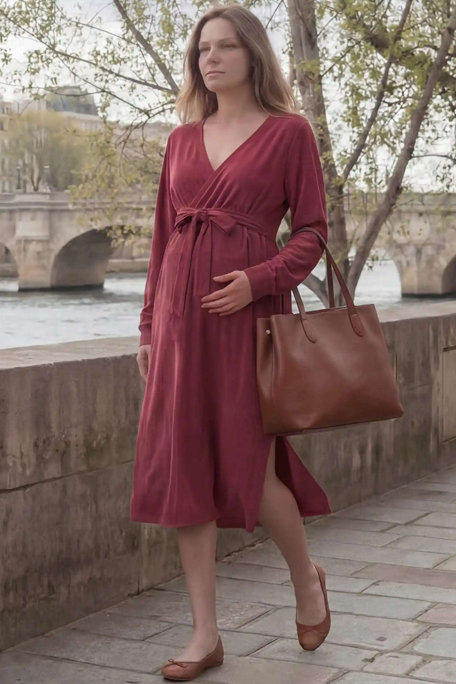 Wrap Front Tie Waist Long Sleeve Maternity Midi Dress Wrap Front Tie Waist Long Sleeve Maternity Midi Dress in Purple featuring adjustable tie waist and side slits on a pregnant woman in outdoor setting, front view.