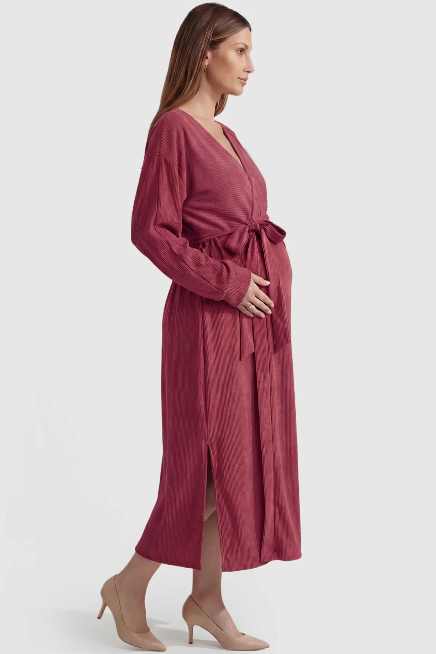 Wrap Front Tie Waist Long Sleeve Maternity Midi Dress Wrap Front Tie Waist Long Sleeve Maternity Midi Dress in Purple featuring adjustable tie waist and side slits on a pregnant model, side view.