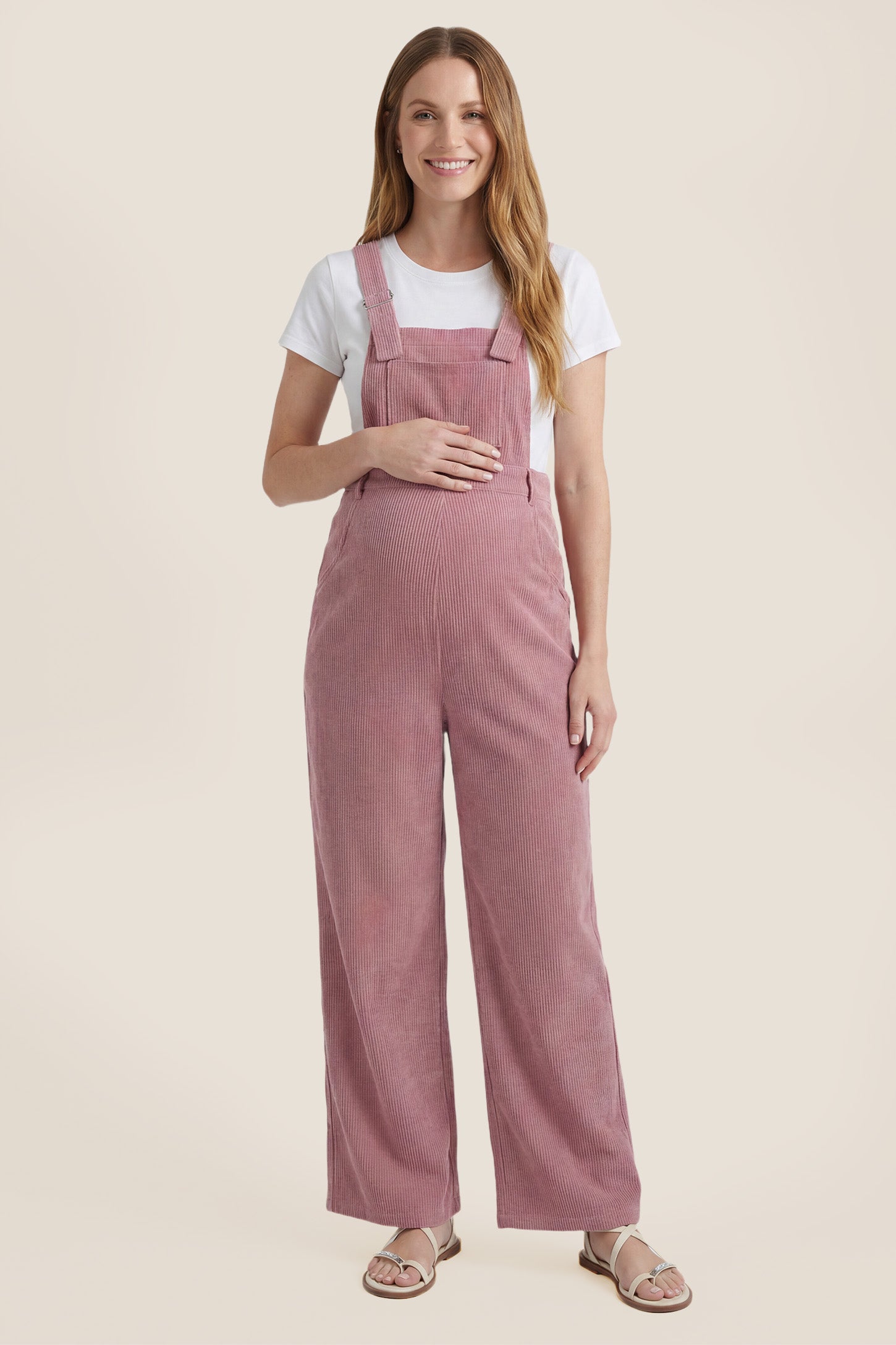 Front view of pink corduroy wide leg maternity jumpsuit