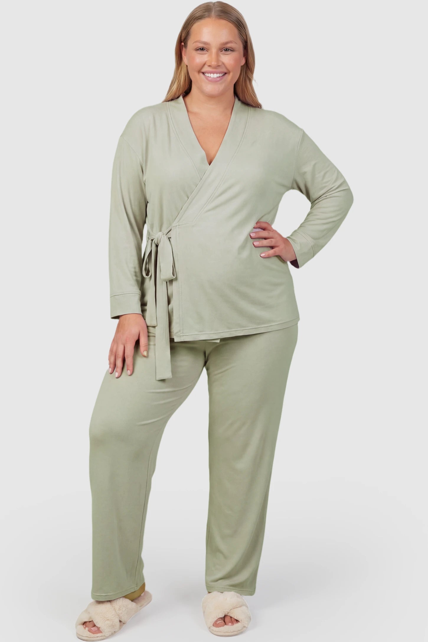 Cotton Wrap Front Long Sleeve Top Wide Leg Pants Maternity Sleepwear Cotton Wrap Front Long Sleeve Top Wide Leg Pants Maternity Sleepwear in Pale Olive featuring natural cotton fabric on a plus size pregnant model showing front.