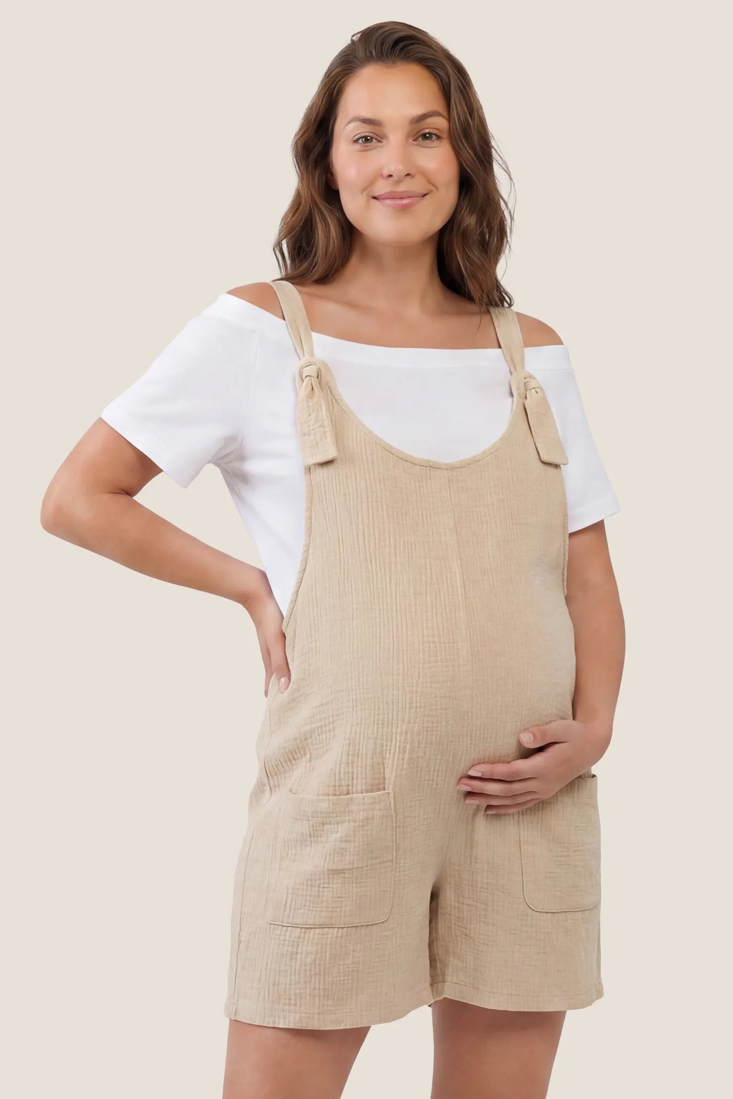 Knot Strap Front Pocket Maternity Romper Front view of beige knot strap front pocket maternity romper for women