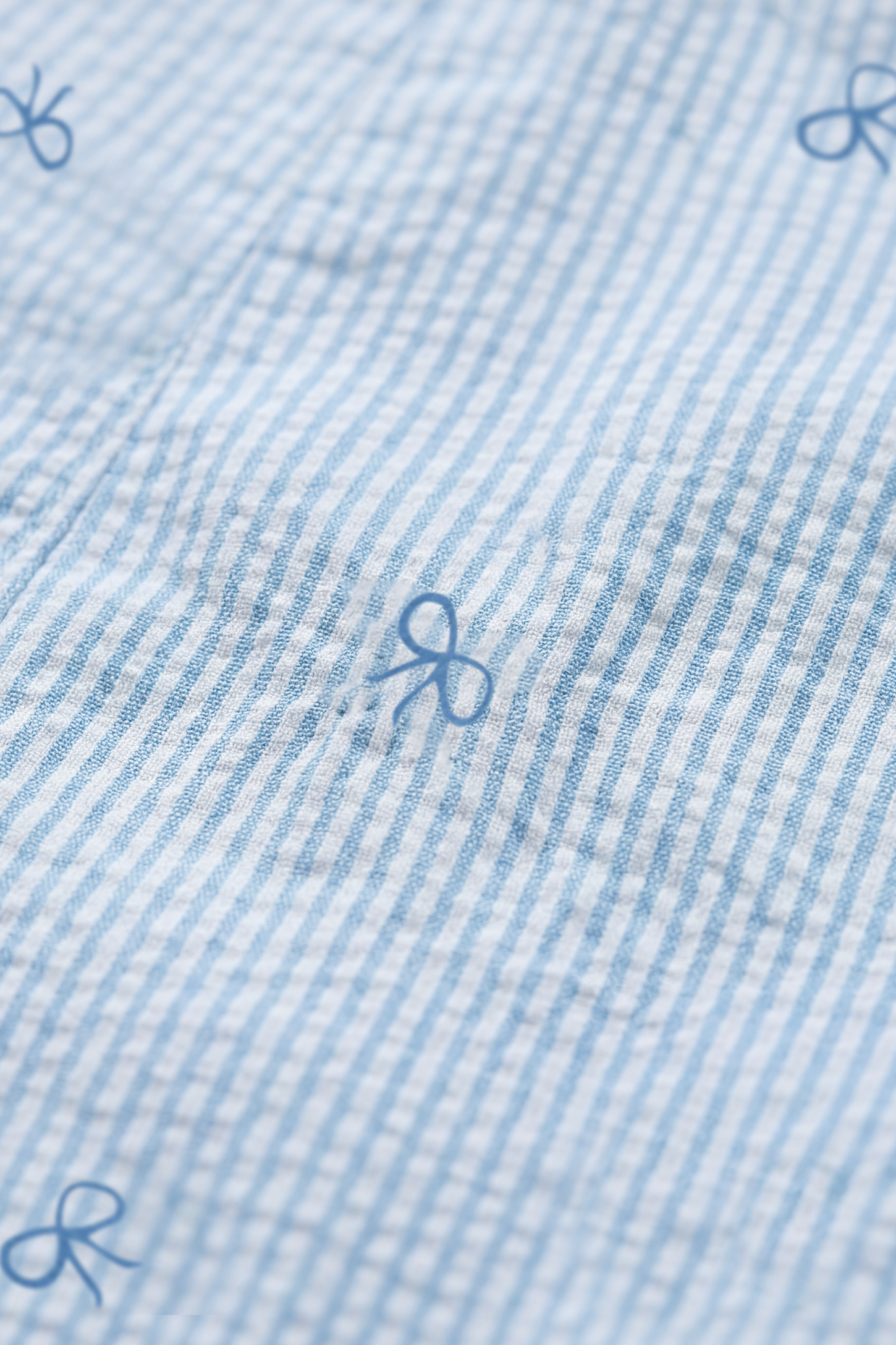 Side-Adjustable Maternity Jumpsuit Comfortable Pregnancy One-Piece Close-up of the shoulder strap on the Side-Adjustable Maternity Jumpsuit Comfortable Pregnancy One-Piece in Baby Blue.