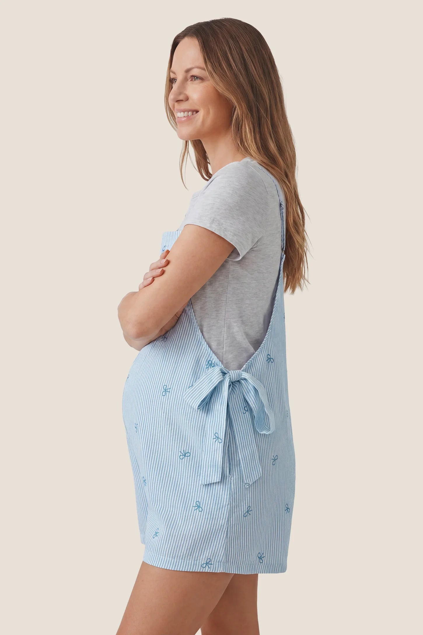 Side-Adjustable Maternity Jumpsuit Comfortable Pregnancy One-Piece Side view of Side-Adjustable Maternity Jumpsuit Comfortable Pregnancy One-Piece in Baby Blue.