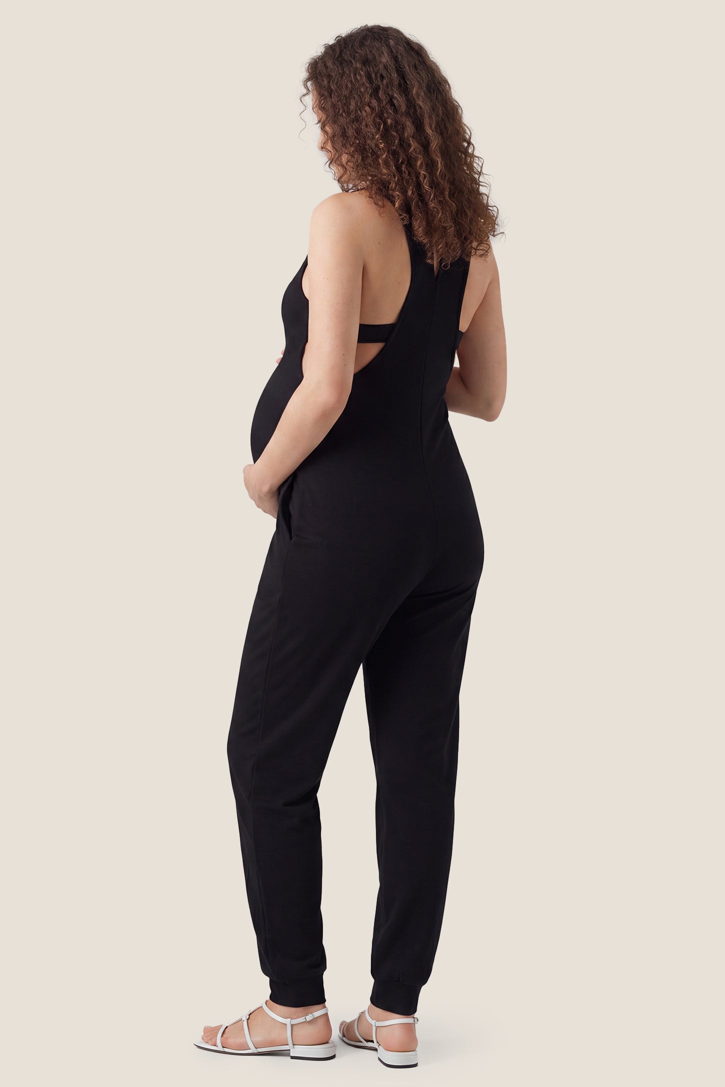 V-Neck Pocketed Maternity Jogger Jumpsuit Back view of black V-neck pocketed maternity jogger jumpsuit