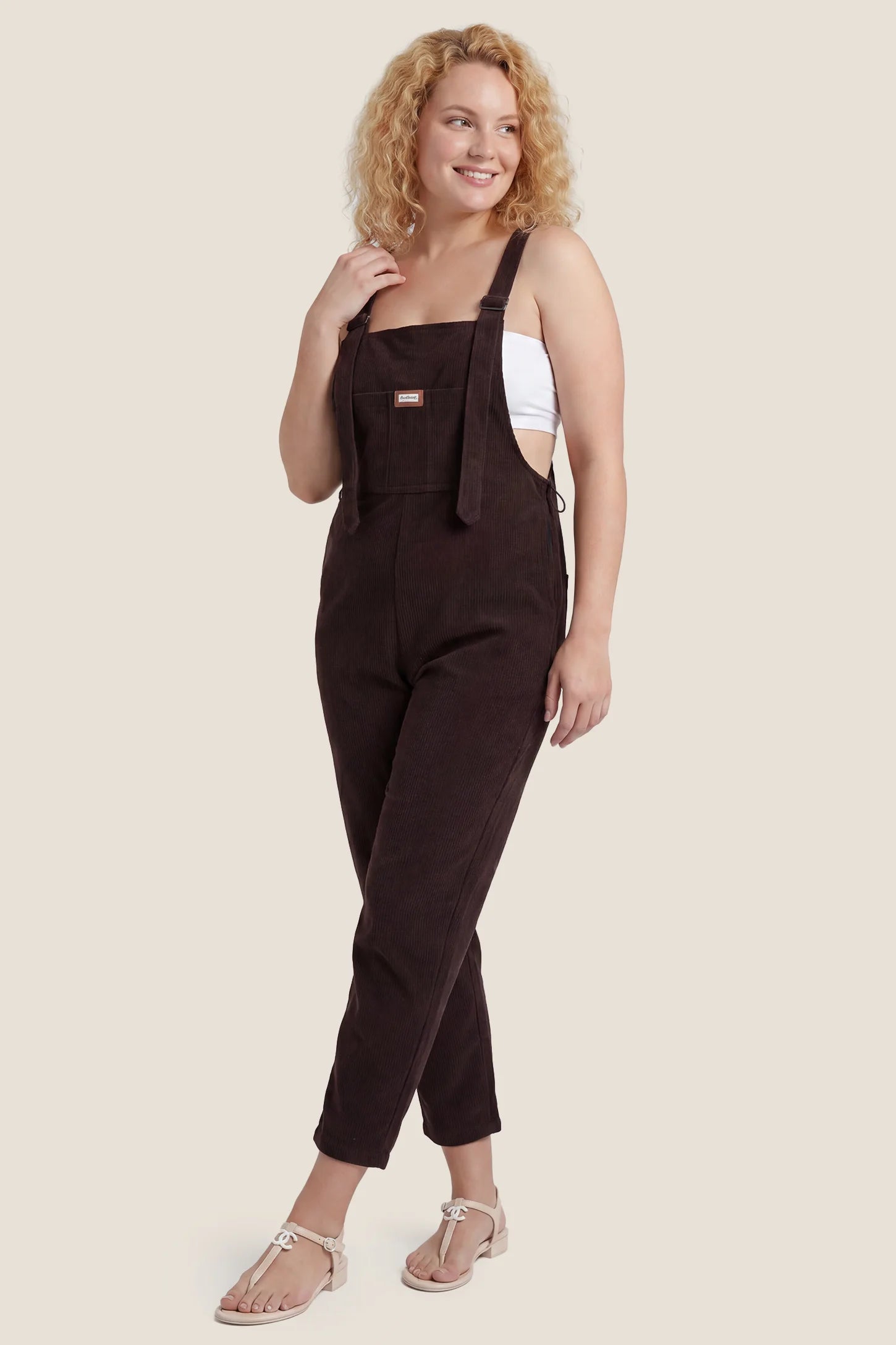 Brown wide leg side stretch panel maternity overalls styled for postpartum wear