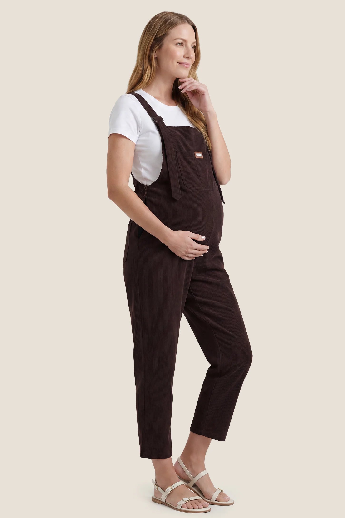 Wide Leg Side Stretch Panel Maternity Overalls Side view of brown wide leg side stretch panel maternity overalls with bump-friendly fit